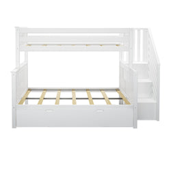 White wooden twin over full bunk bed with storage stairs and under-bed drawers.