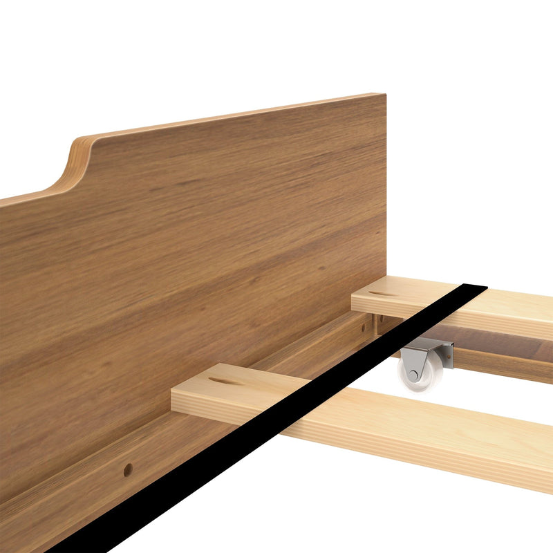 Close-up of walnut wood platform bed frame headboard and wooden slats with caster wheel and assembly hardware