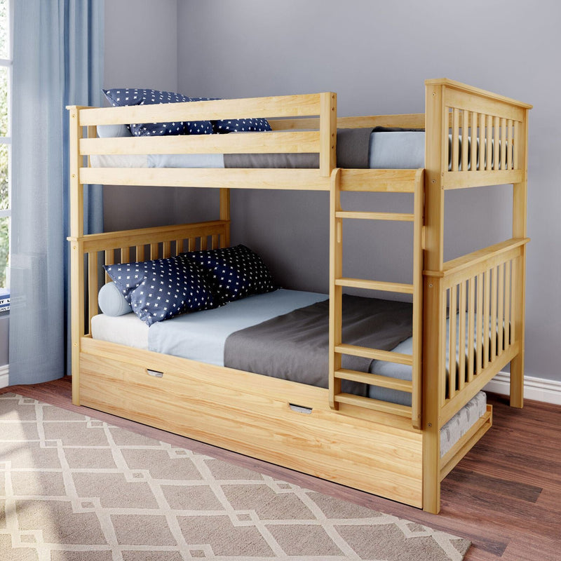 Light natural wood kids' bunk bed with built-in ladder and pull-out trundle, styled with gray bedding and navy star pillows