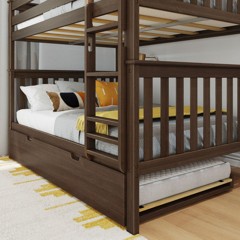 Dark wood bunk bed with pull-out trundle, featuring cozy pillows and blankets in a bright bedroom setting.