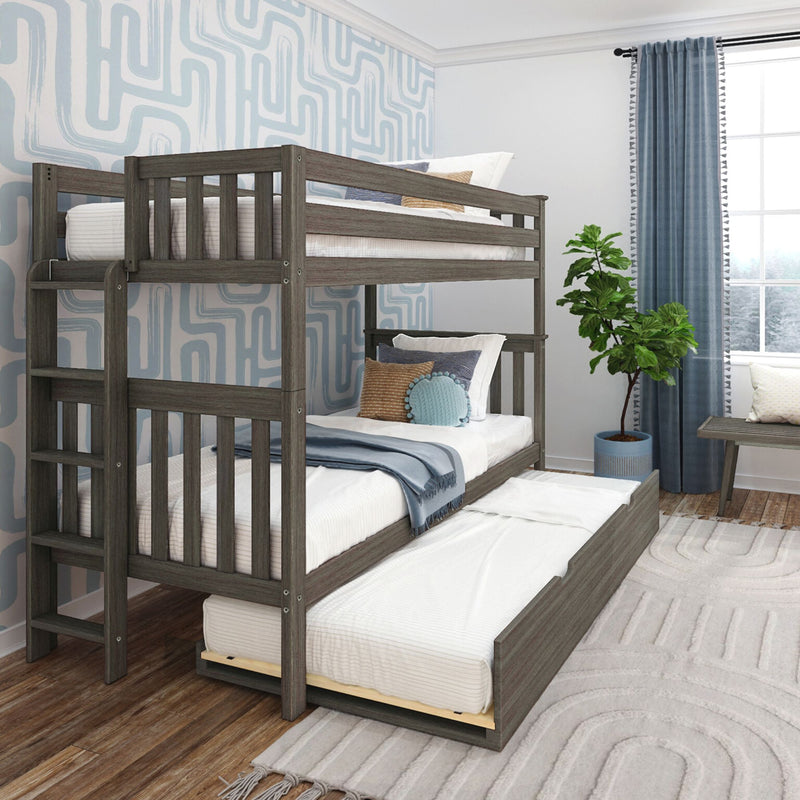 Gray wooden bunk bed with pull-out trundle in a modern kids' bedroom with blue geometric wallpaper, navy curtains, decorative pillows and potted plant