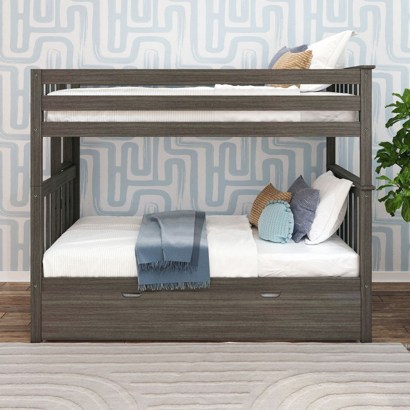 Gray wooden twin bunk bed with built-in storage drawer, white bedding, blue throw blanket and decorative pillows against light-blue geometric wallpaper.