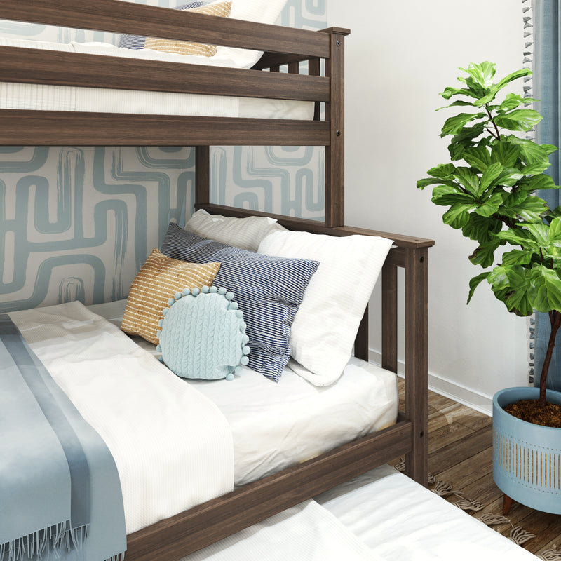 Modern wooden bunk bed in a kids' bedroom with blue-and-white bedding, striped and textured decorative pillows, round knit throw cushion, geometric accent wallpaper and a potted fiddle leaf fig plant