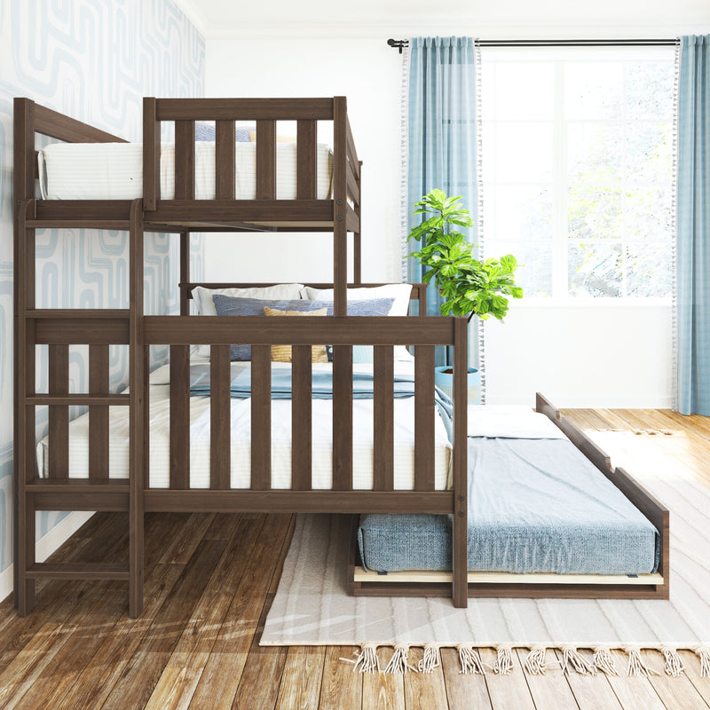 Space-saving wooden twin-over-full bunk bed with pull-out trundle in bright children's bedroom with blue curtains, hardwood floor, rug and decorative pillows