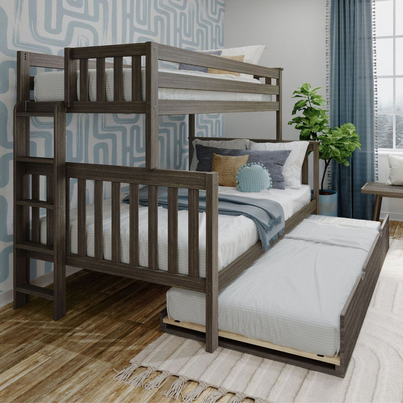 Gray wooden bunk bed with pull-out trundle in modern kids' bedroom, blue geometric wallpaper, layered bedding, decorative pillows and potted plant