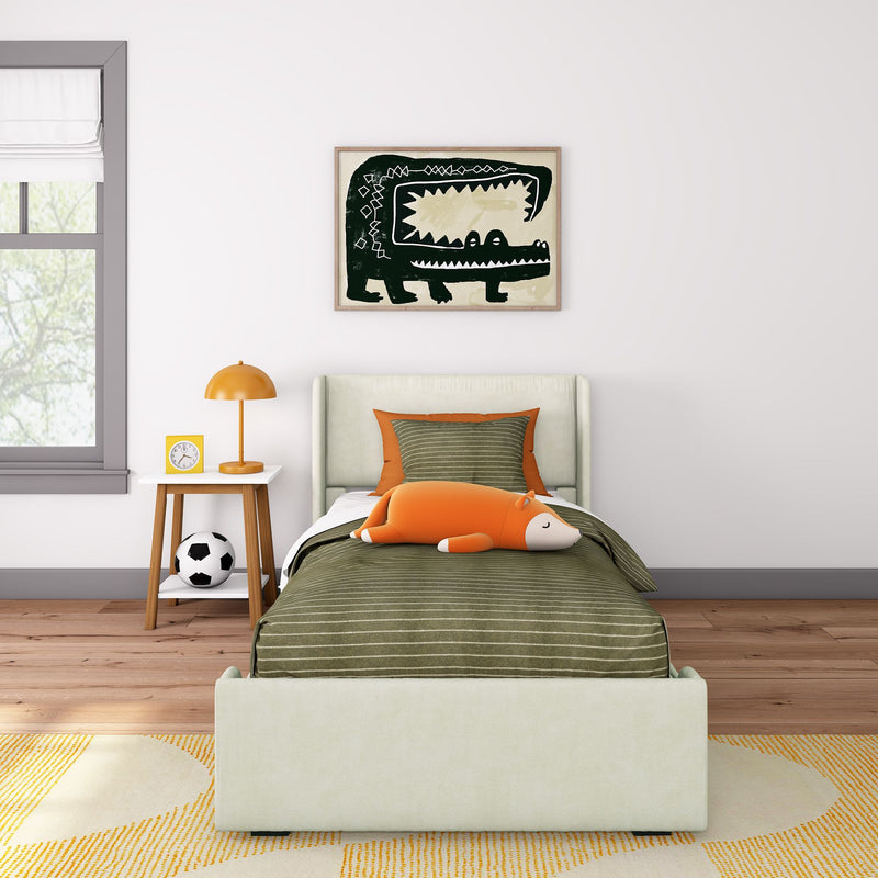 Kids bedroom decor: green striped bedding, orange fox plush toy, framed crocodile wall art, orange bedside lamp and soccer ball