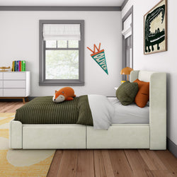 Cozy children's bedroom with a plush bed, fox pillow, and stylish decor accents.