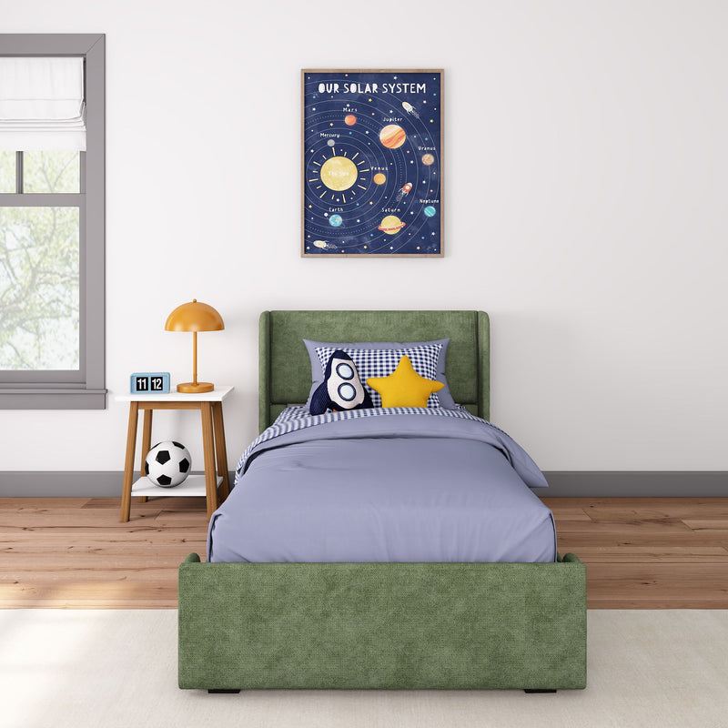 Kids bedroom with solar system wall art above green bed and rocket plush toy, space nursery decor.