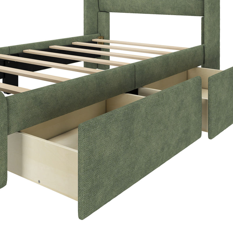 Close-up of green upholstered platform bed frame with wooden slats and built-in under-bed storage drawers in linen-like fabric