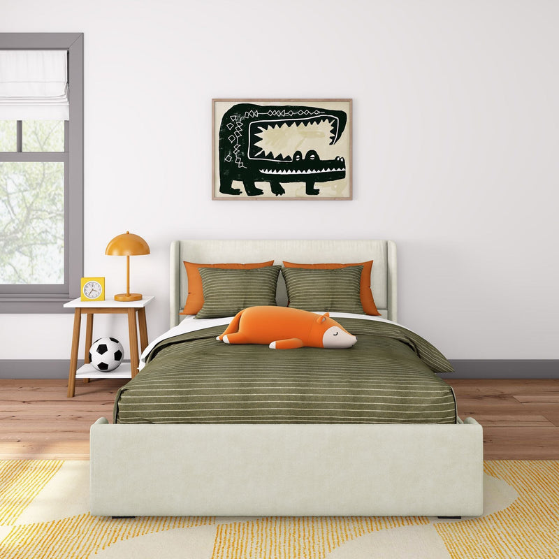 Kids bedroom interior with green striped bedding, orange accent pillows and lamp, plush fox toy on bed, framed crocodile wall art, bedside table with clock and soccer ball