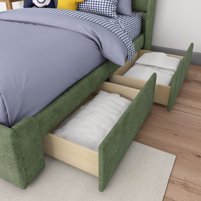 Green upholstered storage bed with light blue duvet and navy gingham sheets, open underbed wooden drawers storing pillows and folded linens