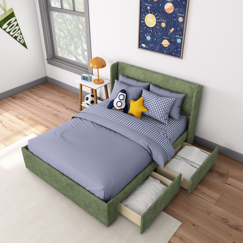 Kids bedroom decor with green upholstered storage bed and pull-out drawers, blue gingham bedding, rocket and star pillows, solar system wall art, bedside lamp and soccer ball on wood floor