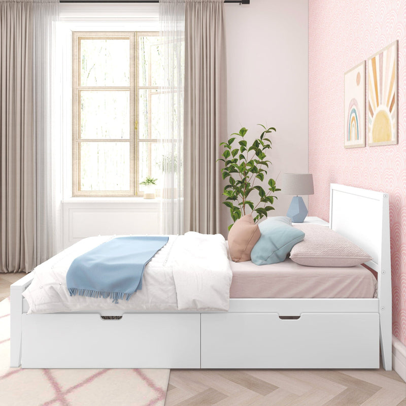 Pastel girl's bedroom with white storage daybed, light blue throw, pink patterned wallpaper, sheer curtains, potted plant and framed rainbow and sun wall art
