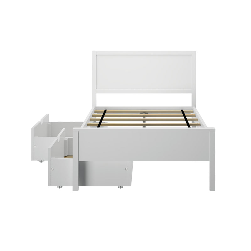 White wooden platform bed frame with headboard and slatted mattress support and built-in under-bed storage drawers on casters, front view