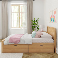 Modern bedroom with wooden bed frame, white bedding, pink throw, large window, and indoor plant.