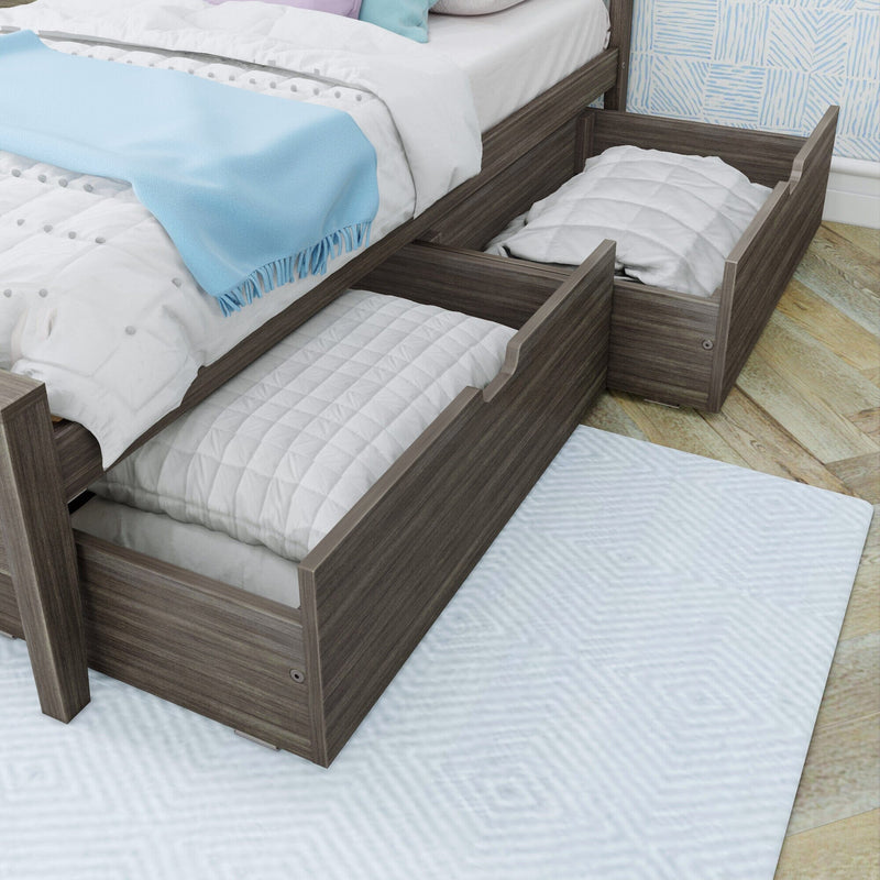 Gray wood trundle bed with under-bed pull-out storage drawers, white quilted bedding and light blue throw blanket