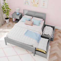 Gray storage bed with pastel pillows and drawers in a modern bedroom setting.