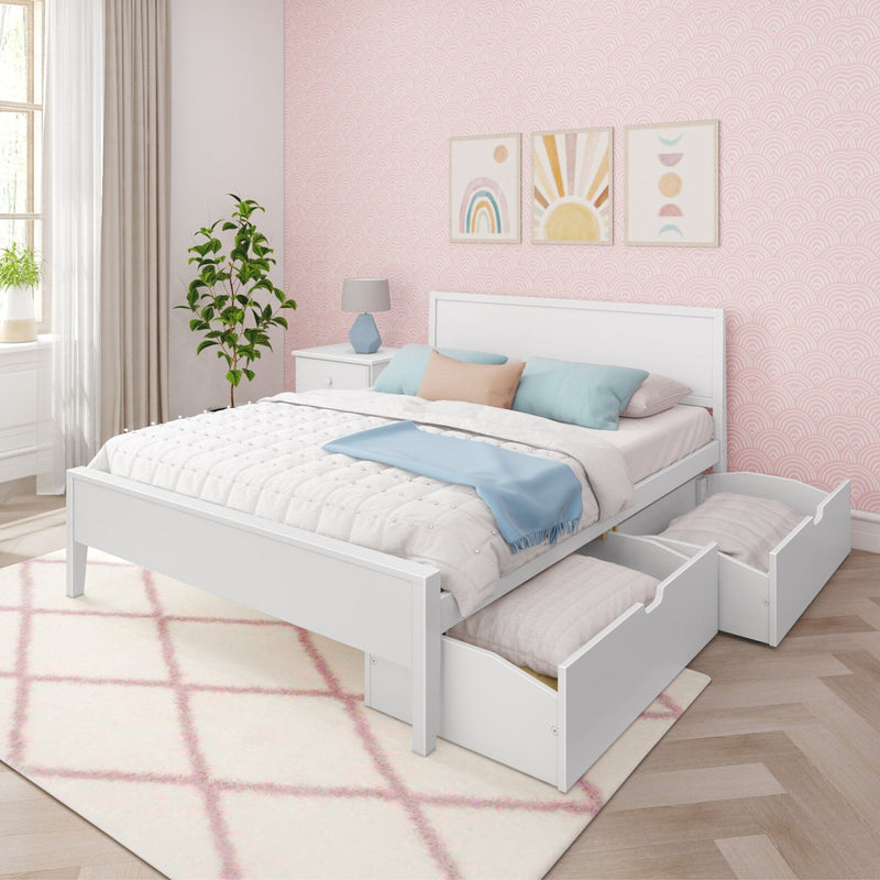 White wooden storage bed with two under-bed drawers, pastel bedding and blue throw in pink patterned girls' bedroom with rainbow wall art and potted plant