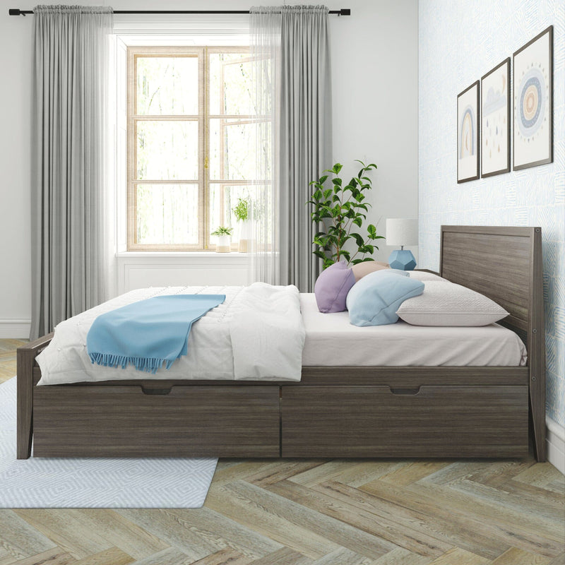 Light-filled modern bedroom with gray wood platform storage bed with drawers, white bedding, blue throw and pastel pillows, large window with sheer curtains, potted plant and framed wall art on herringbone wood floor
