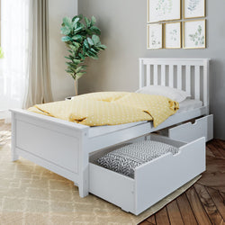 White twin bed with storage drawers and yellow polka dot blanket in a modern bedroom setting.