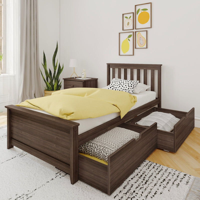 Wooden twin bed with built-in underbed storage drawers, yellow duvet and polka-dot pillow in a modern bedroom with nightstand, potted plant, and fruit wall art