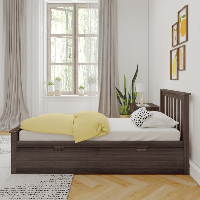 Modern sunlit bedroom with dark wood storage bed, yellow duvet, white linens, large window with potted plants and minimalist framed art
