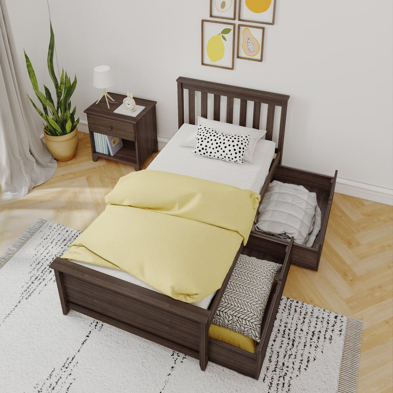 Dark wood twin bed with yellow duvet and polka-dot pillow, built-in under-bed storage drawers with blankets, nightstand with lamp, potted plant and modern wall art in minimalist bedroom