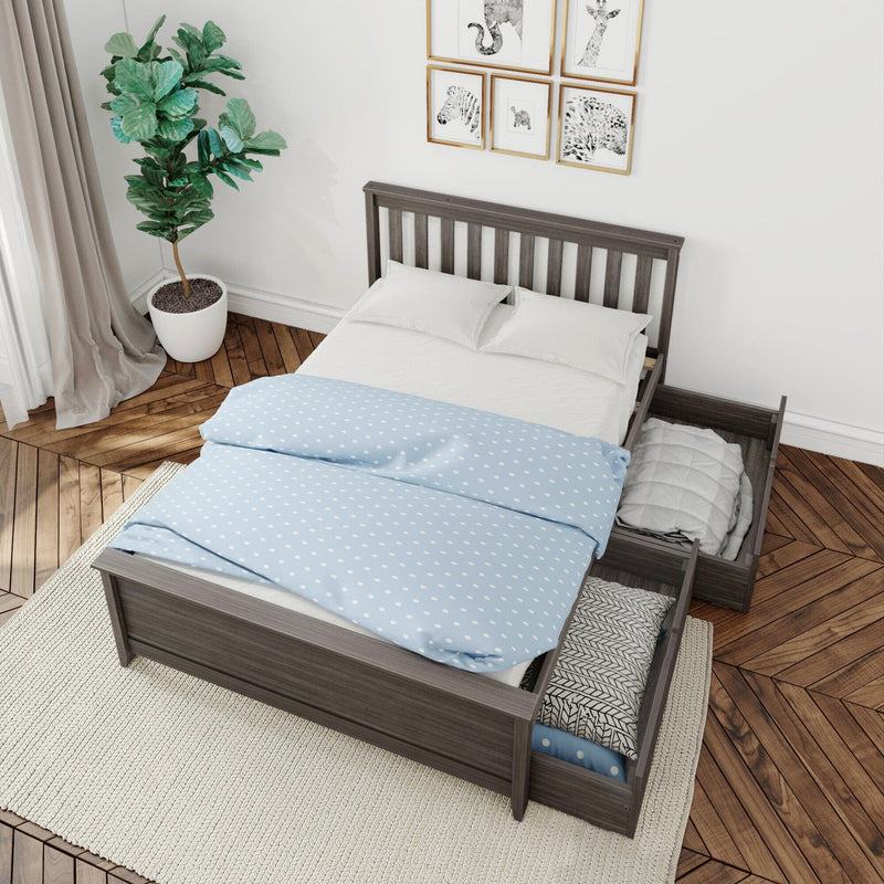 Modern gray wooden bed frame with under-bed storage drawers, blue polka-dot duvet and white pillows in styled bedroom with potted plant, gallery wall and herringbone wood floor
