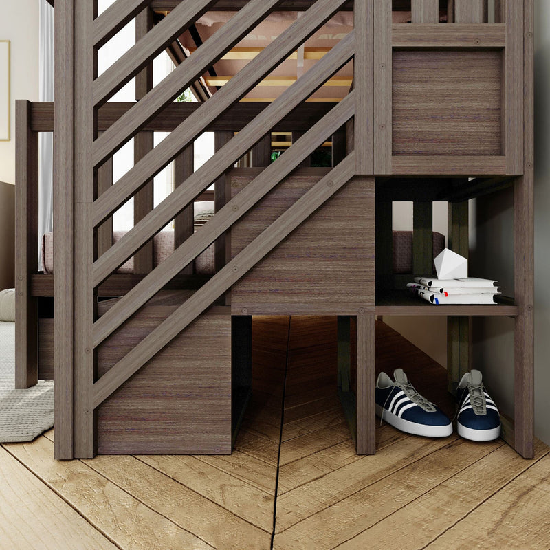 Modern wooden loft bunk bed with diagonal slat railing, built-in cubby shelves for storage, navy sneakers and stacked books on hardwood floor in a kids bedroom