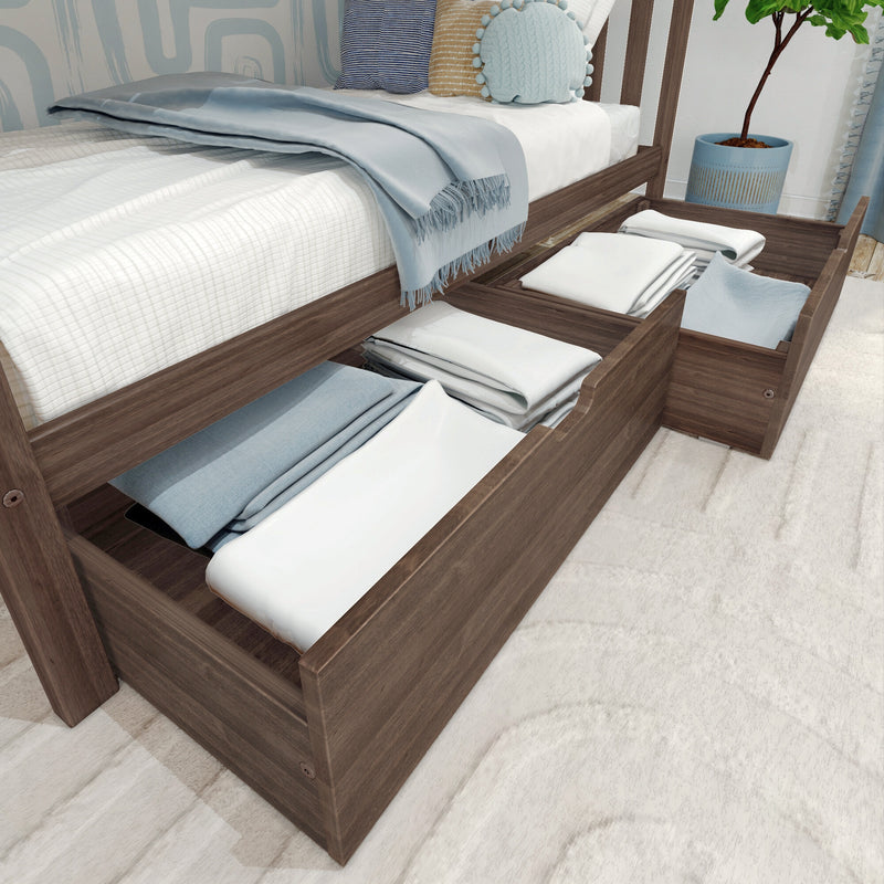 Wooden platform storage bed with pull-out under-bed drawers neatly holding folded linens and light blue bedding in a modern bedroom