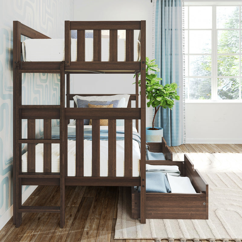Solid dark wood bunk bed with pull-out trundle and storage drawers in a bright kids' bedroom with blue curtains, patterned wallpaper, decorative pillows and potted plant