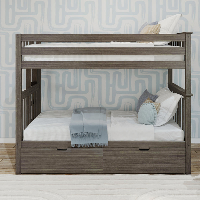 Gray wood twin-over-twin bunk bed with built-in storage drawers, white and blue bedding and pillows against light blue geometric wallpaper