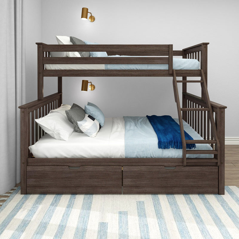 Dark wood twin-over-full bunk bed with ladder and under-bed storage drawers, light blue bedding and decorative pillows, brass wall sconces in kids bedroom