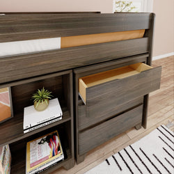 Dark wood loft bed with open drawer and bookshelves in a modern bedroom.