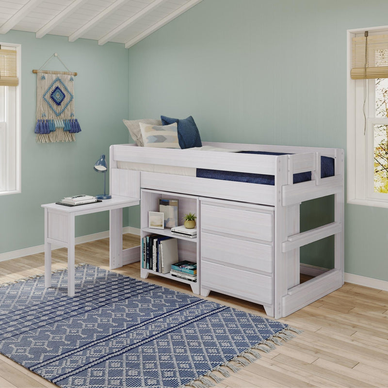 White children's loft bed with built-in desk and storage, navy and patterned pillows, blue geometric rug, mint green walls and boho wall hanging