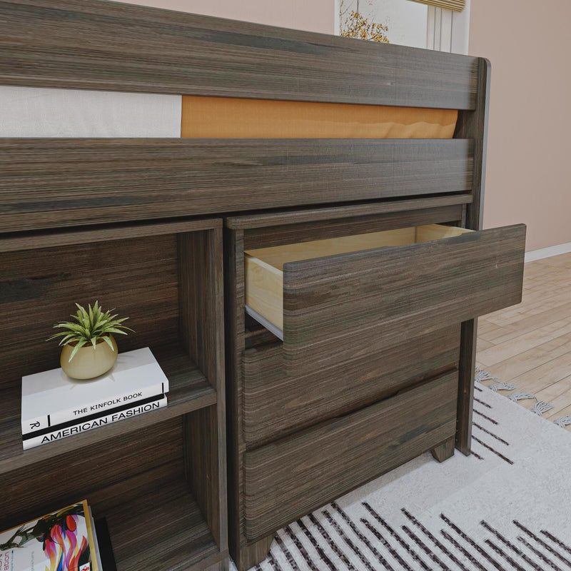 Modern dark wood dresser with open drawers and built-in bedside shelf holding a small potted plant and stacked books on hardwood floor and patterned rug in a bedroom