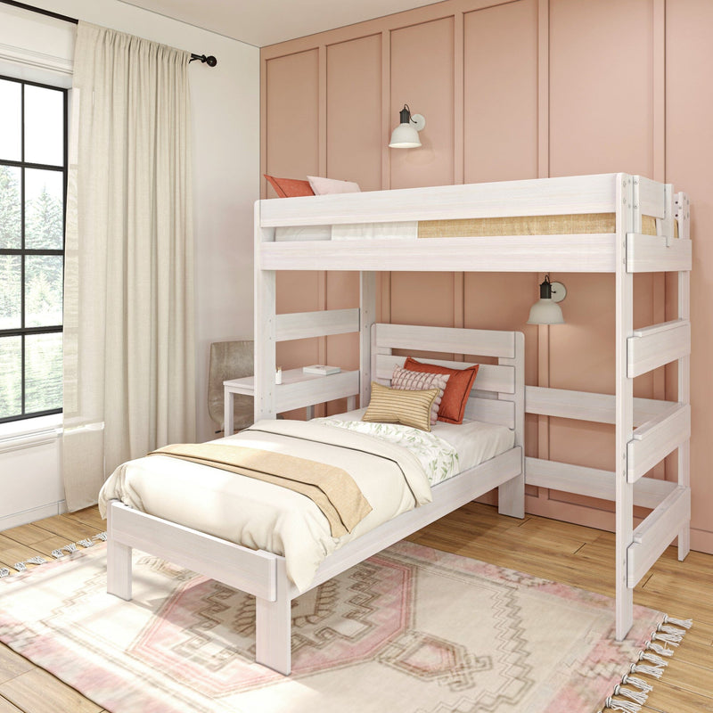 White wooden twin-over-twin bunk bed in a bright modern bedroom with pink paneled accent wall, natural window light, neutral bedding and patterned area rug
