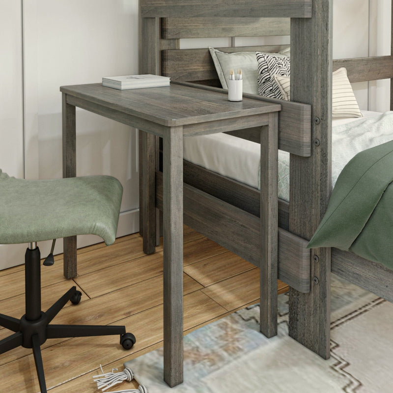Rustic gray wooden bunk bed with attached desk, book and pencil holder, green accent chair on hardwood floor — compact small bedroom workspace solution