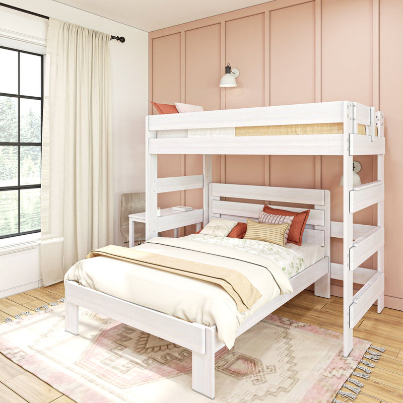 White wooden bunk bed in a cozy children's bedroom with blush pink paneled accent wall, large black-framed window with cream curtains, layered neutral bedding and coral throw pillows