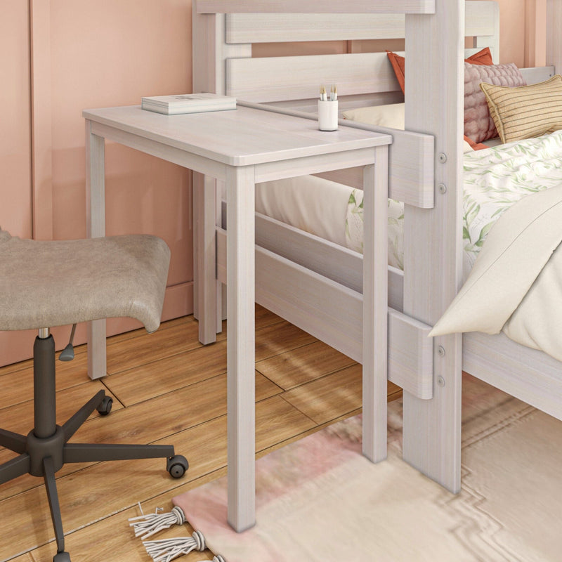Whitewashed wooden bedside table attached to a loft bed in a pink bedroom with floral bedding, textured throw pillows, swivel desk stool and hardwood floor