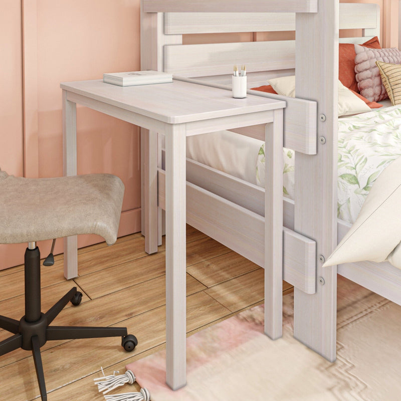 Whitewashed wooden loft bed with built-in pull-out desk in a cozy peach-walled bedroom, hardwood floor, textured pillows and swivel desk stool