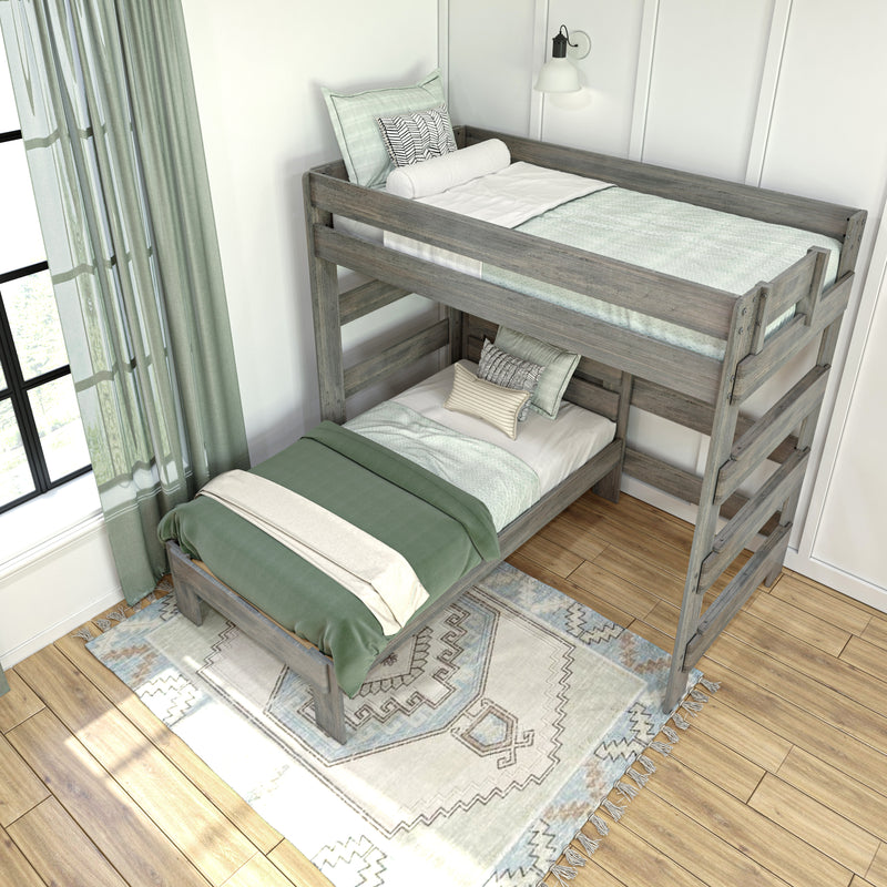 Rustic gray wooden twin bunk beds with sage green bedding, patterned pillows, woven rug and sheer curtains in a bright modern kids' bedroom