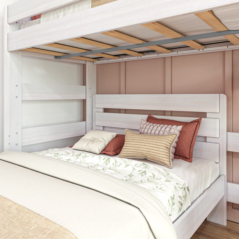 Whitewashed wooden twin bunk bed with visible slats, floral bedding and textured decorative pillows in a neutral modern kids' bedroom