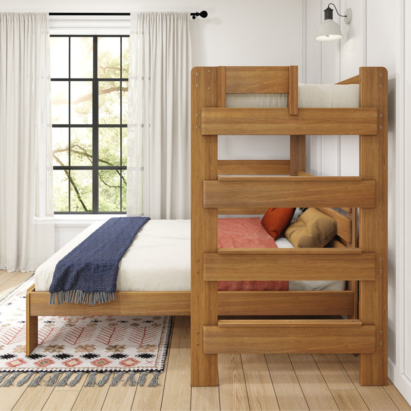 Solid natural wood bunk bed in bright farmhouse-style kids bedroom with white curtains, black-framed grid window, patterned rug and blue throw blanket