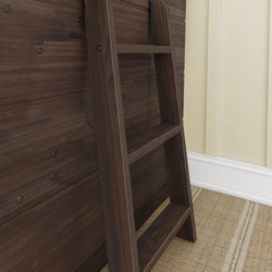 Wooden loft ladder against a dark wooden paneled wall with beige carpet and wainscoting.