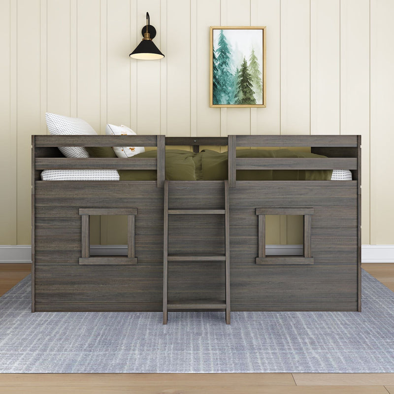 Wooden kids bunk bed with ladder and olive-green bedding, patterned pillows, beige shiplap wall, black wall sconce and framed pine watercolor — cozy cabin-style children's bedroom décor