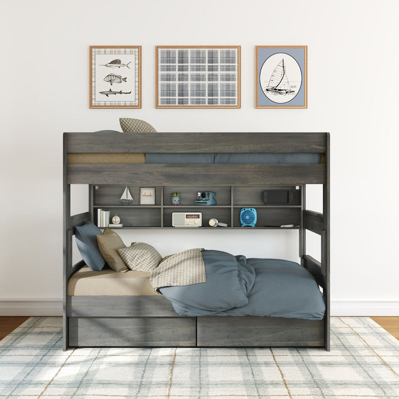 Modern gray wooden bunk bed with built-in shelves and under-bed drawers, blue bedding, plaid rug and nautical wall art in kids' bedroom