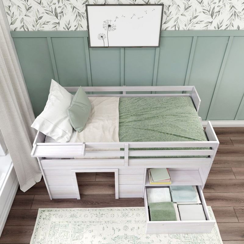 White wooden loft children's bed with pull-out storage drawer, mint green bedding and pillows, floral wallpaper and green paneling in a kids' bedroom