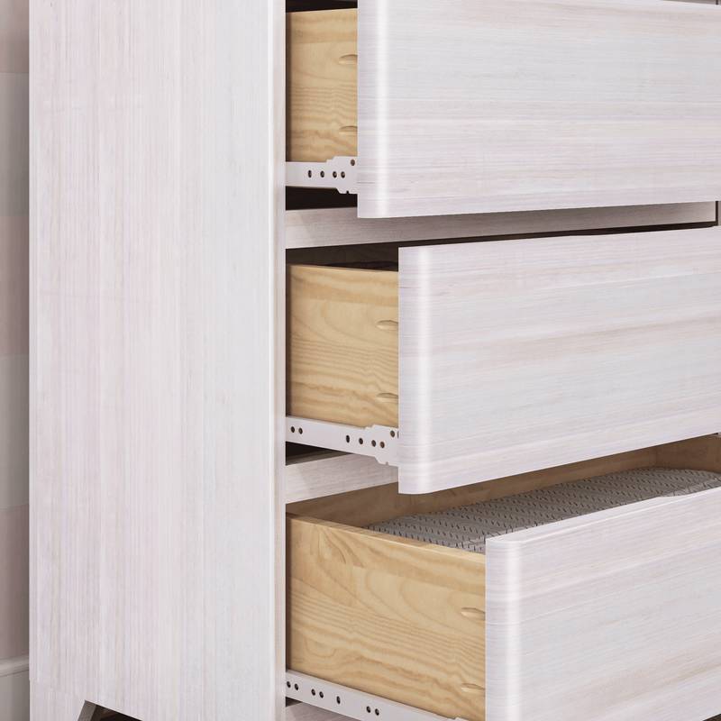 Whitewashed wooden dresser with two partially open drawers showing natural wood interiors and metal drawer slides, modern bedroom storage furniture