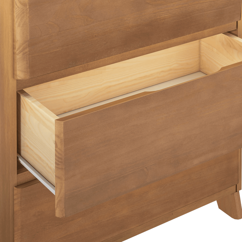 Mid-century modern wooden dresser with natural brown finish and one open drawer revealing light wood interior and metal side slides, bedroom storage furniture